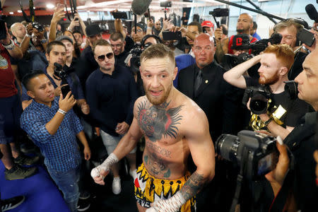 Conor McGregor of Ireland talks with reporters following a workout at the UFC Performance Center in Las Vegas, Nevada, U.S., August 11, 2017. REUTERS/Steve Marcus/Files