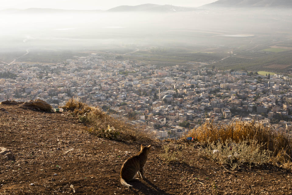 In this Friday, Sept. 27, 2019 photo, a general view of the Israeli Arab village of Iksal near Nazareth, northern Israel. Electoral gains made by Arab parties in Israel, and their decision to endorse one of the two deadlocked candidates for prime minister, could give them new influence in parliament. But they also face a dilemma dating back to Israel's founding: How to participate in a system that they say relegates them to second-class citizens and oppresses their Palestinian brethren in Gaza and the occupied West Bank. (AP Photo/Oded Balilty)