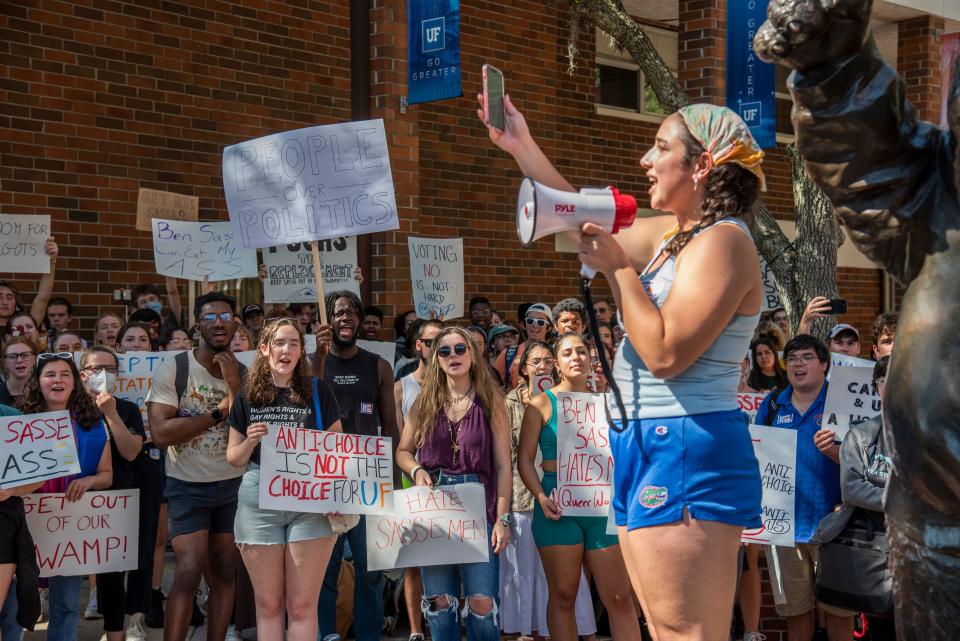 Student Organizer Ava Kaplan talks to the crowd during the protest of Sen. Ben Sasse’s open forum discussion at Emerson Alumni Hall in Gainesville, Fla., on Monday, Oct. 10, 2022. (Lawren Simmons/Special to the Sun)