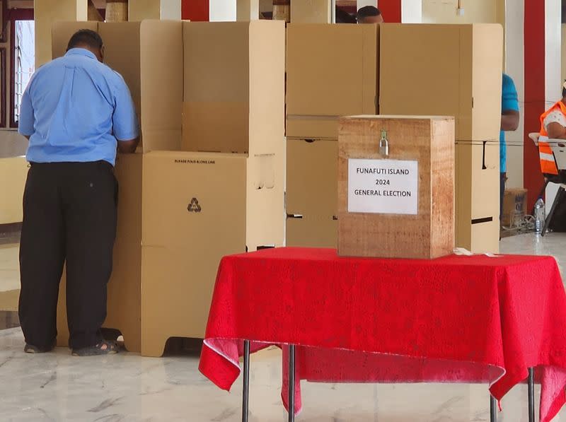 A man votes on the day of the general elections, in Funafuti