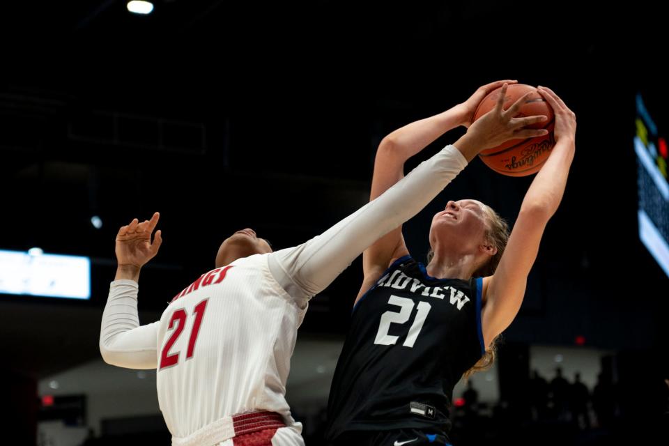 Midview center Mary Meng (21) grabs a rebound over Princeton forward Kali Fortson (21) in the second quarter of the OHSAA Division I state semifinal game on March 9, 2023 University of Dayton Arena in Dayton, Ohio. 