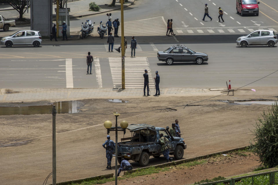 Security forces stand guard in Meskel Square in central Addis Ababa, Ethiopia Sunday, June 23, 2019. Ethiopia's government foiled a coup attempt in a region north of the capital and the country's military chief was shot dead, the prime minister Abiy Ahmed said Sunday in a TV announcement. (AP Photo/Mulugeta Ayene)