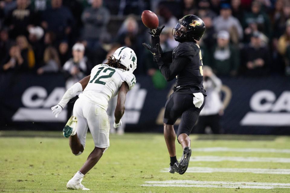 Nov 6, 2021; West Lafayette, Indiana, USA; Purdue Boilermakers wide receiver David Bell (3) catches the ball while Michigan State Spartans cornerback Chester Kimbrough (12) defends in the second half at Ross-Ade Stadium.