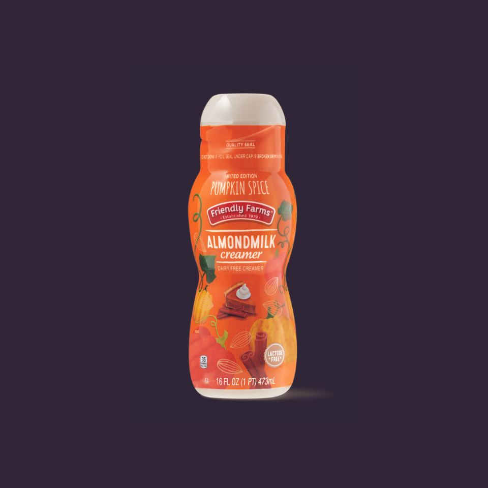 Pumpkin almond milk bottle on a dark background