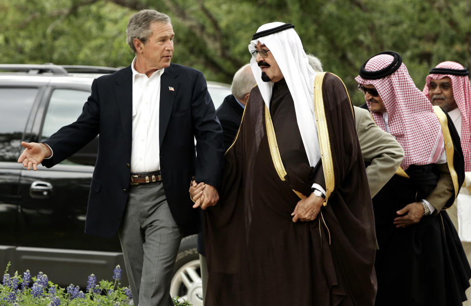 FILE - In this April 25, 2005 file photo, President George W. Bush greets then Saudi Crown Prince Abdullah at his ranch in Crawford, Texas. The kingdom of Saudi Arabia has enjoyed the ultimate protected status from the United States throughout its short history. Ties were especially close between King Fahd and his successor King Abdullah with President George W. Bush. That’s even after Osama bin Laden’s al-Qaida launched the Sept. 11 attacks, in part over America’s military presence in the kingdom and fifteen of the 19 Sept. 11 hijackers were Saudi citizens. (AP Photo/Gerald Herbert, File)