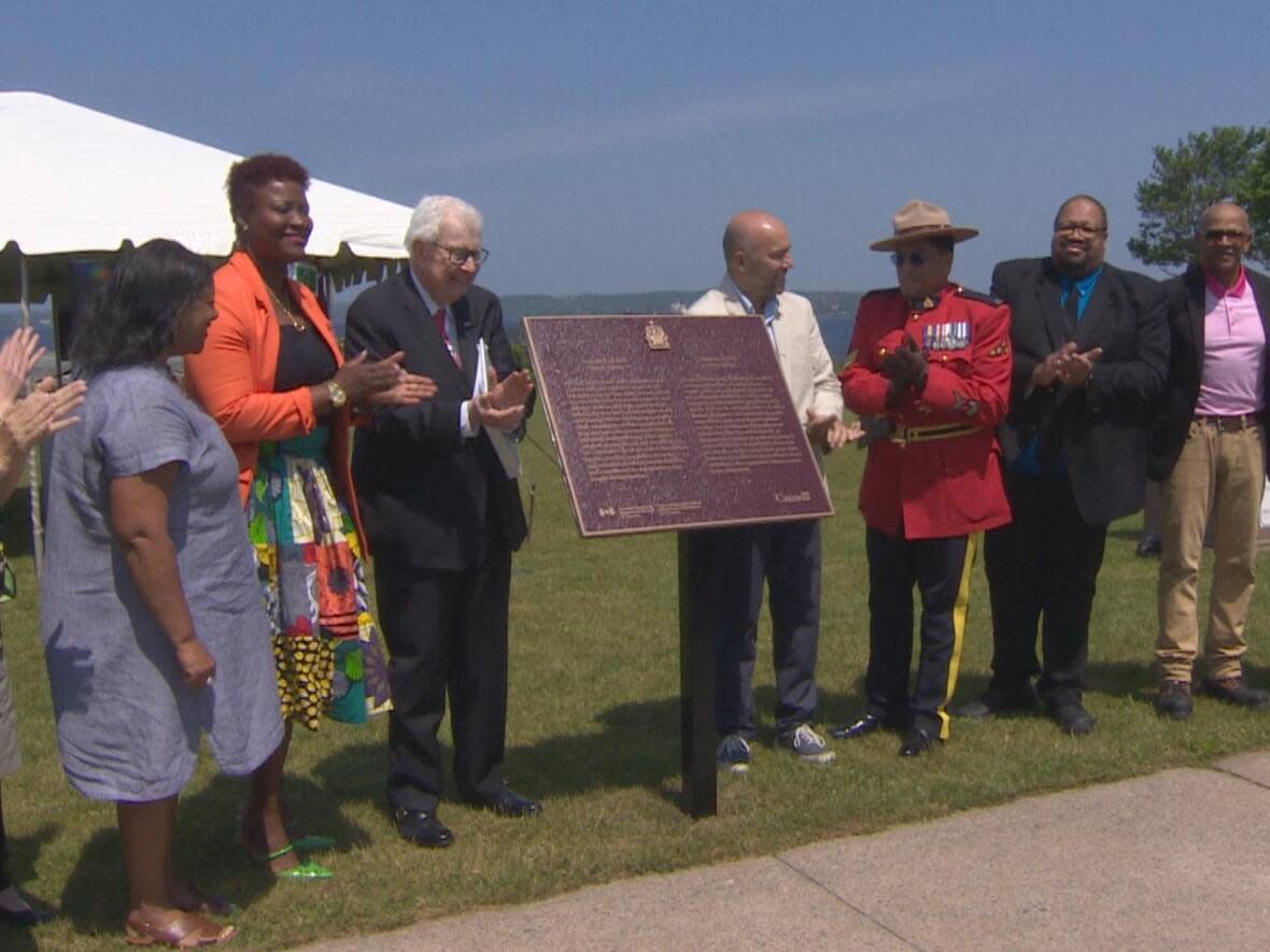 Officials gathered on Monday morning to unveil the plaque in George Dixon's honour.  (Brian MacKay/CBC - image credit)