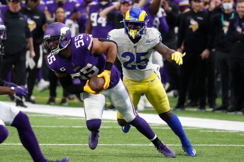 Minnesota Vikings outside linebacker Anthony Barr (55) intercepts a pass ahead of Los Angeles Rams running back Sony Michel (25) during the first half of an NFL football game, Sunday, Dec. 26, 2021, in Minneapolis. (AP Photo/Bruce Kluckhohn)