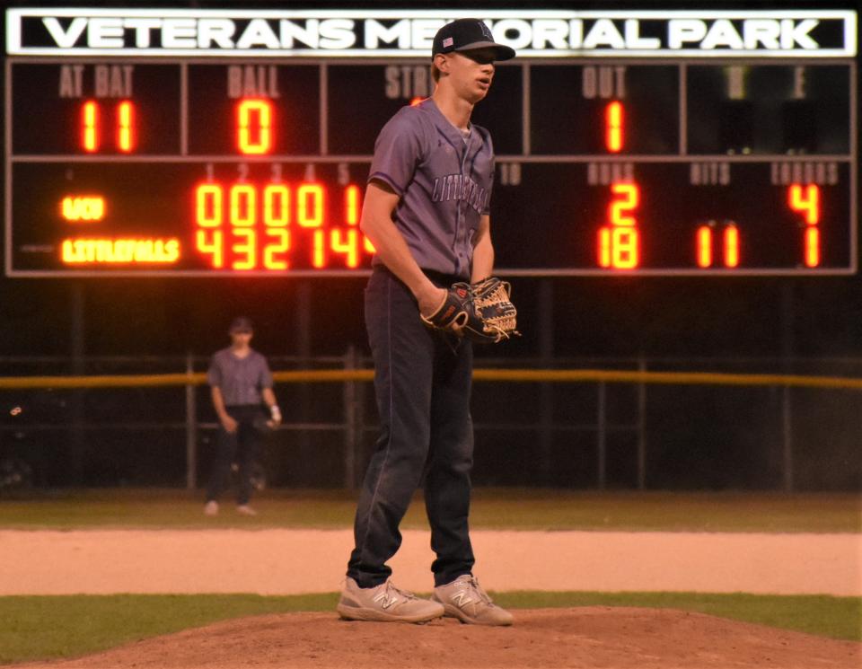 Little Falls pitcher Wyatt Beadle checks the catcher's sign during the final inning of his combined no-hitter against West Canada Valley with teammate Chase Regan Friday at Veterans Memorial Park.