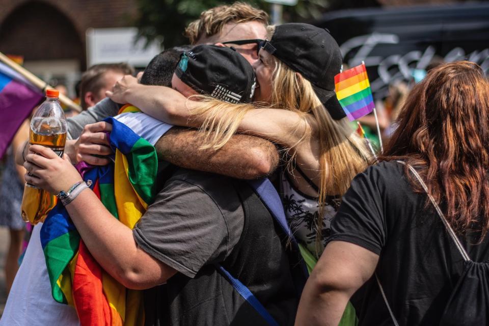 A father who wore a "Free Dad Hugs" T-shirt to the Pittsburgh's Pride Parade shared what it was like to embrace kids who had been rejected by their parents.