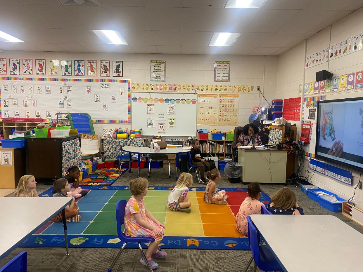 Shambra Watkins reads a book about emotions to her kindergarten class.