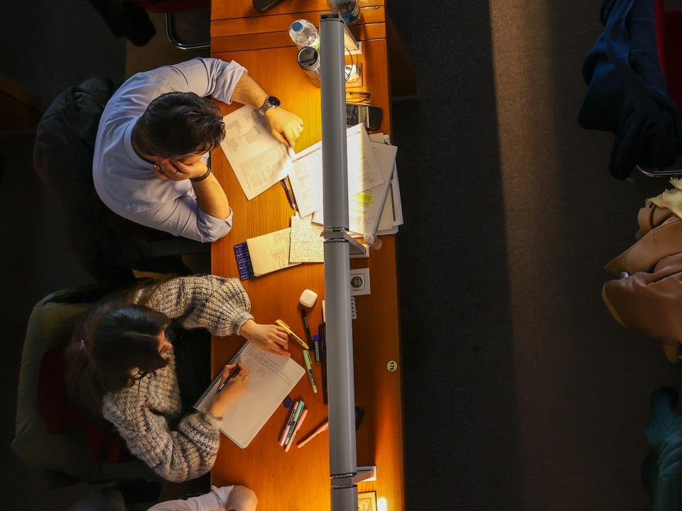 People studying at a library.