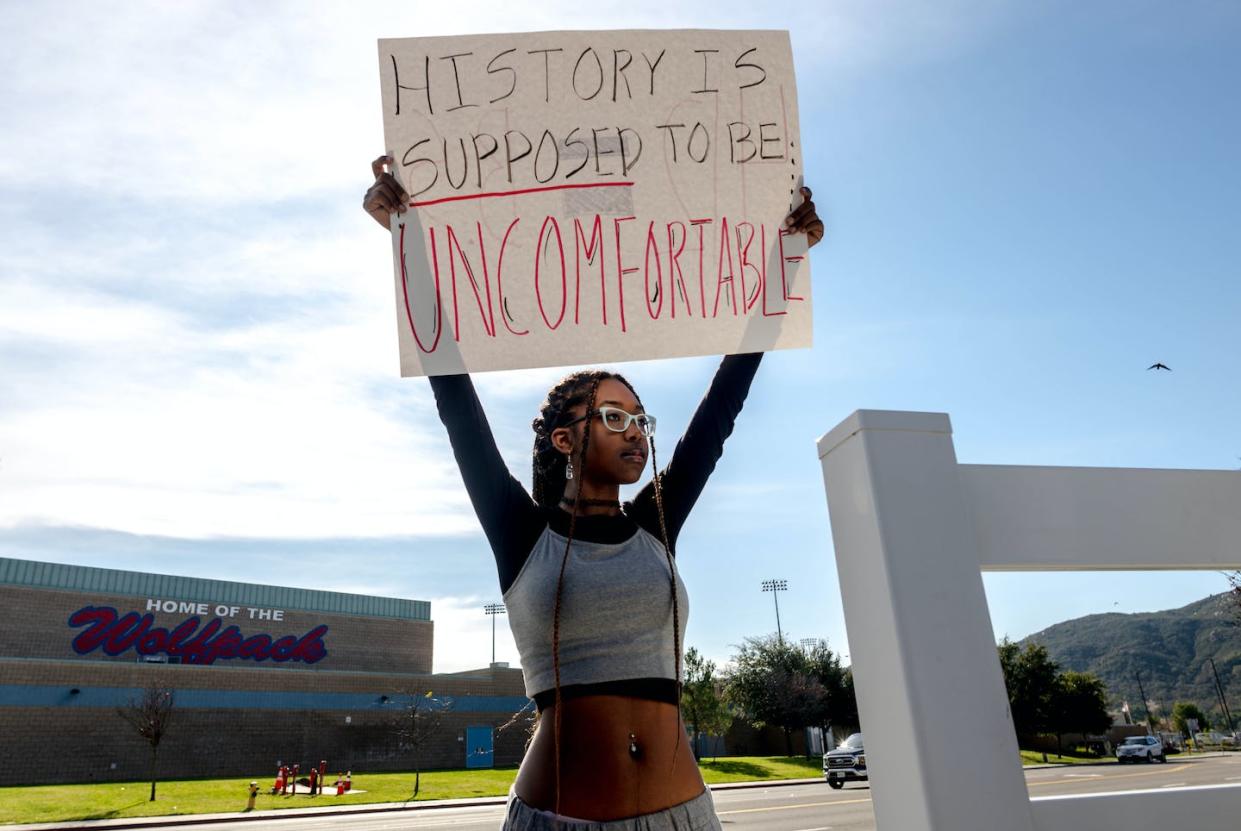 A high school student in California holds a sign in protest of her school district’s ban on critical race theory curriculum. <a href="https://www.gettyimages.com/detail/news-photo/student-samaya-robinson-holds-a-sign-in-protest-of-the-news-photo/1245683863?adppopup=true" rel="nofollow noopener" target="_blank" data-ylk="slk:Watchara Phomicinda/The Press-Enterprise via Getty Images;elm:context_link;itc:0;sec:content-canvas" class="link ">Watchara Phomicinda/The Press-Enterprise via Getty Images</a>