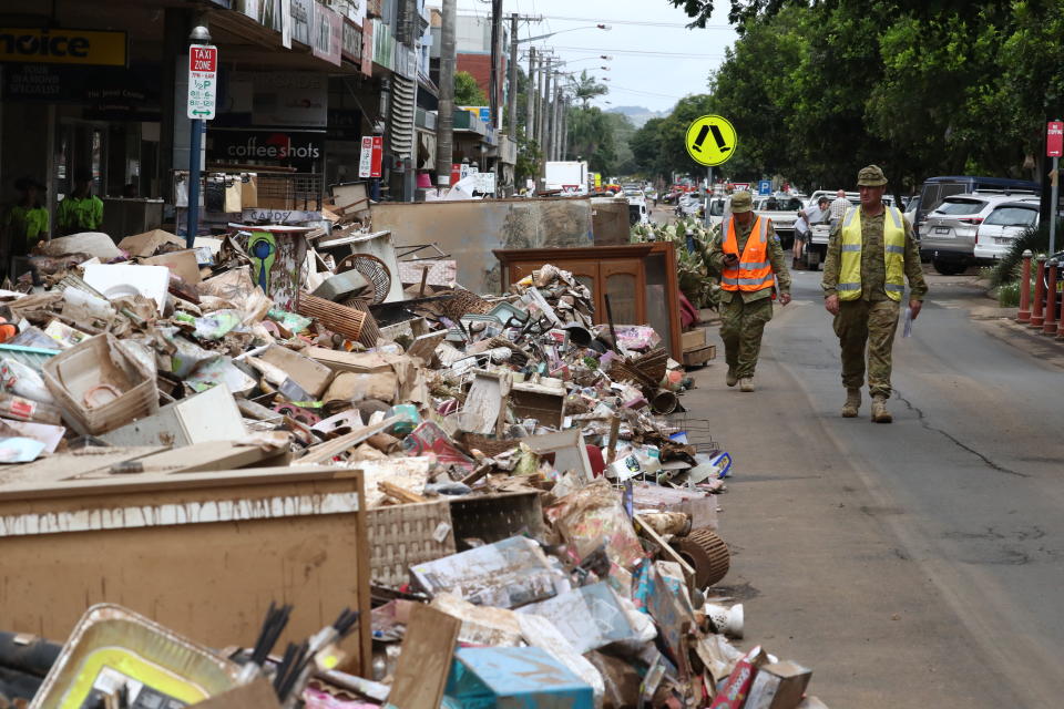 Australian Defence Force personnel assist with the clean up after the floods in the Central Business District of Lismore, NSW. Source: AAP
