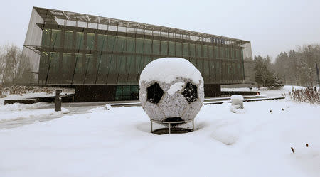 FILE PHOTO: The FIFA headquarters are seen during a snowfall in Zurich, Switzerland, January 10, 2017. REUTERS/Arnd Wiegmann/File Photo