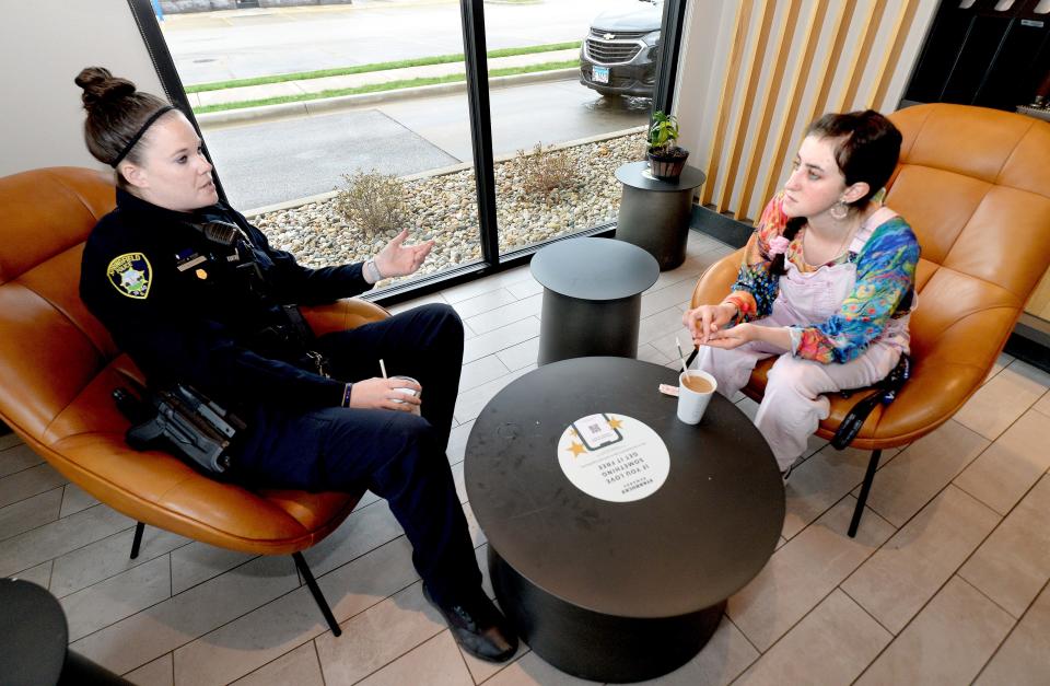 Springfield police officer Taylor Sullivan, left, talks with Becca Hurley of Auburn at the Starbucks on Dirksen Parkway on Thursday morning. Police met up with residents during a "Coffee with a Cop" event. [Thomas J. Turney/The State Journal-Register]