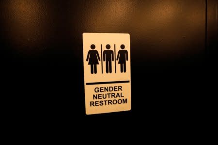 FILE PHOTO -  A sign is seen on a gender neutral restroom wall in New York City, U.S., April 19, 2017. REUTERS/Mike Segar