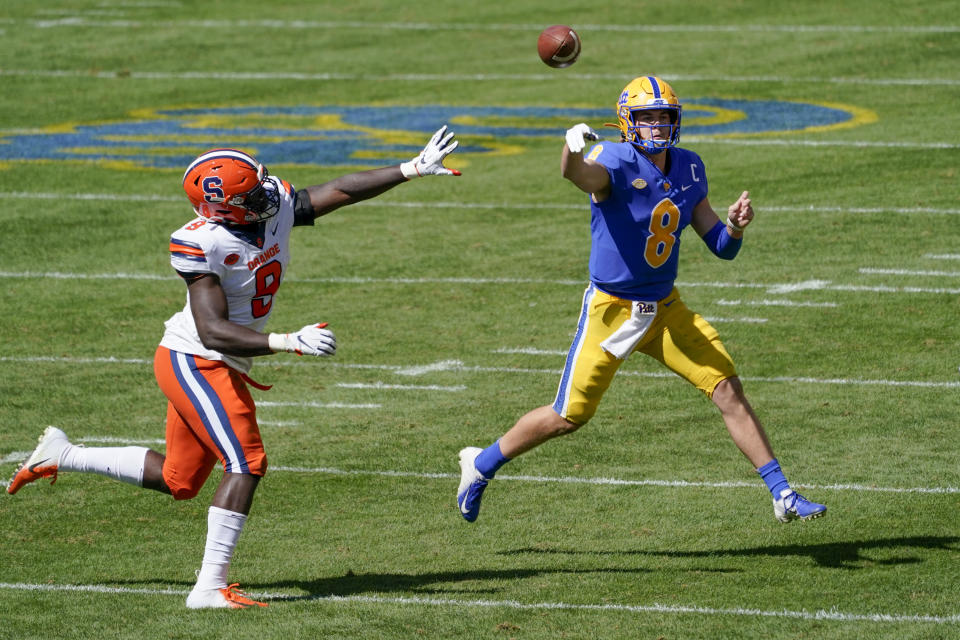 Pittsburgh quarterback Kenny Pickett (8) throws a pass as Syracuse defensive lineman Kingsley Jonathan (9) pressures during the first half of an NCAA college football game, Saturday, Sept. 19, 2020, in Pittsburgh. (AP Photo/Keith Srakocic)