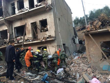 Rescue workers search at site after an explosion hit a town in Fugu county, Shaanxi province, China, October 24, 2016. China Daily/via REUTERS