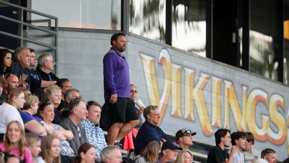 North Kitsap athletic director Matt Stanford makes his way down stadium stairs during the North Kitsap's boys soccer quarterfinal game against Sammamish on Friday, May 19, 2023.