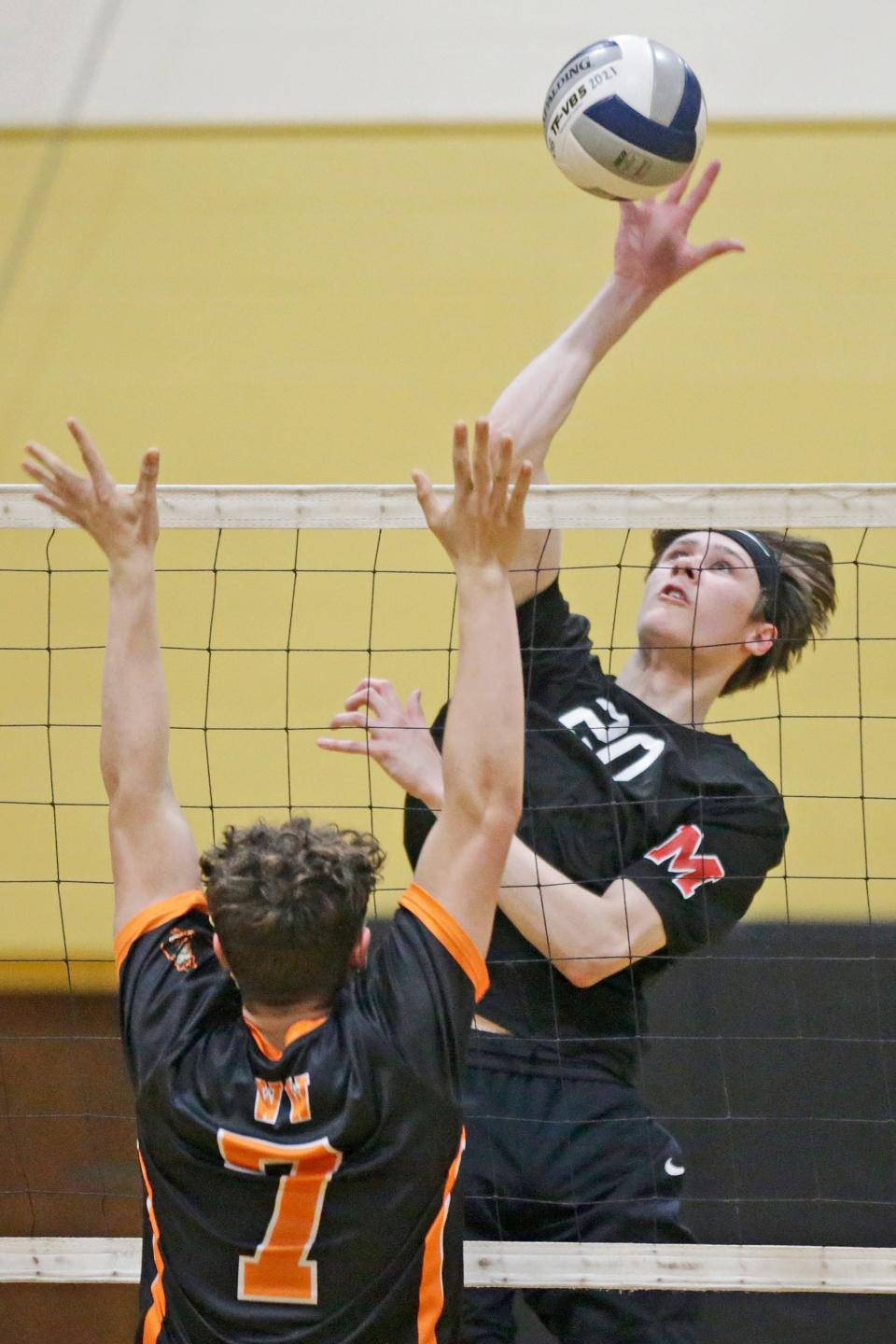 Mount St. Charles/North Smithfield's Thomas Matchett goes up for a kill during the 2022 season.