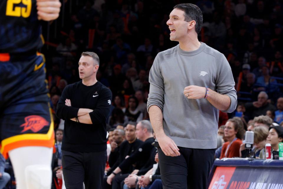 Toronto coach Darko Rajakovic, left, and Oklahoma City coach Mark Daigneault shout instructions during the Thunder's 135-127 win against the Raptors in double overtime Sunday night at Paycom Center.