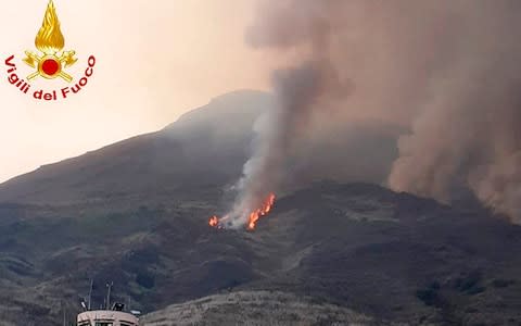 In this frame grab taken from  footage provided by the Italian Firefighters, smoke billows from the volcano on the Italian island of Stromboli. - Credit: Italian fire service/AP