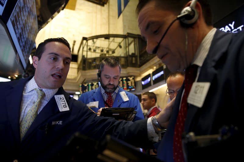 Traders work on the floor of the New York Stock Exchange in New York, December 16, 2015. REUTERS/Brendan McDermid