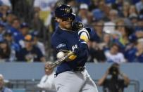 Oct 15, 2018; Los Angeles, CA, USA; Milwaukee Brewers shortstop Orlando Arcia (3) hits a two run home run against the Los Angeles Dodgers in the seventh inning in game three of the 2018 NLCS playoff baseball series at Dodger Stadium. Mandatory Credit: Richard Mackson-USA TODAY Sports