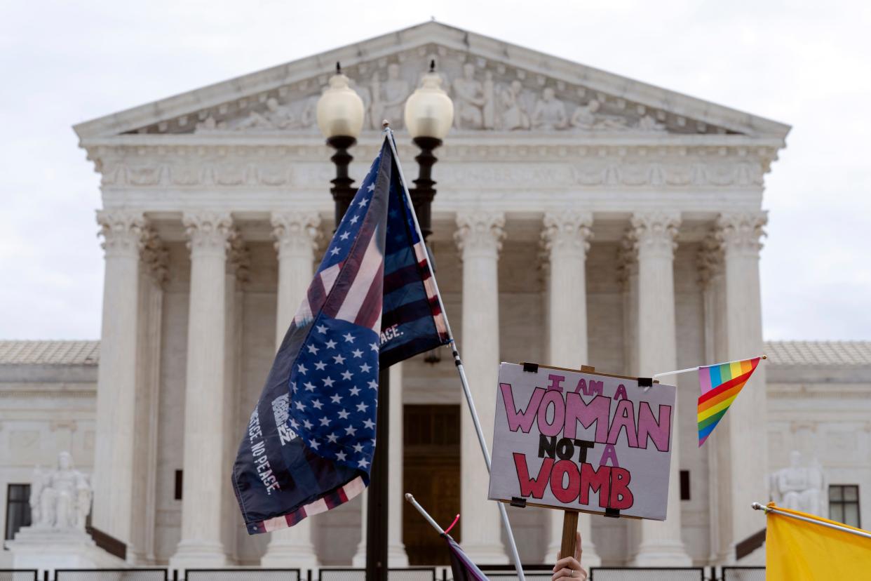 Abortion-rights activists protest outside of the U.S. Supreme Court on Capitol Hill in Washington, Tuesday, June 21, 2022.