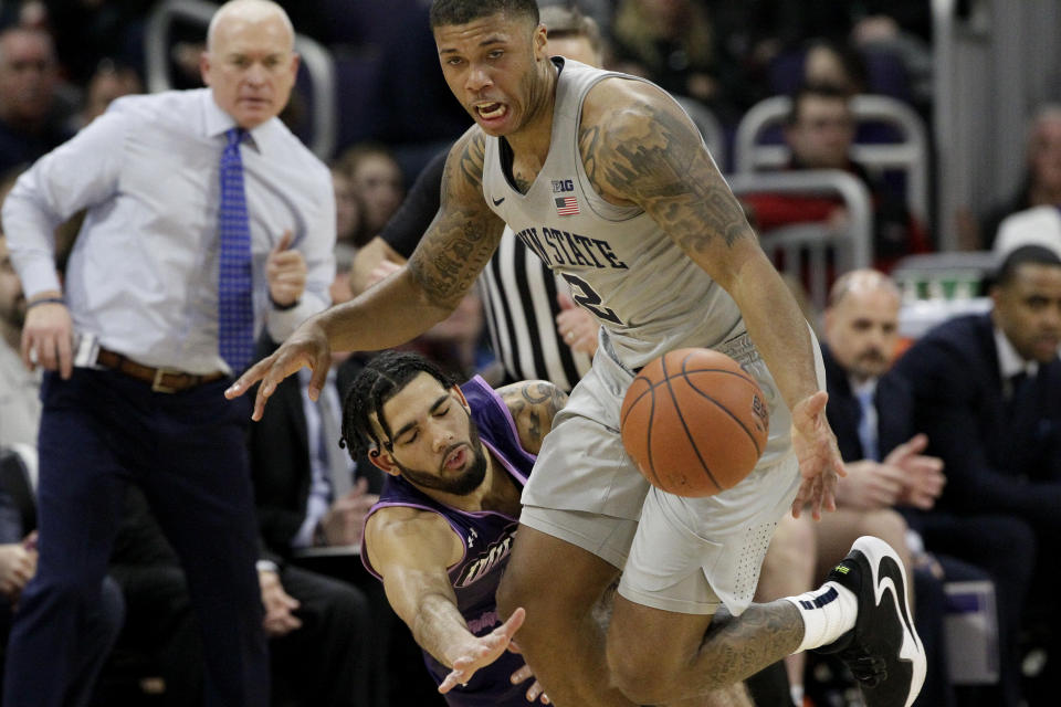 Penn State guard Myles Dread, right, battles for the ball against Northwestern guard Boo Buie during the first half of an NCAA college basketball game in Evanston, Ill., Saturday, March 7, 2020. (AP Photo/Nam Y. Huh)