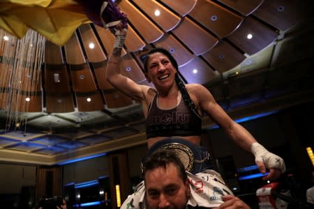Miriam Gutierrez "La Reina", 36, celebrates her victory over Samantha Smith for the lightweight European Championship in Torrelodones