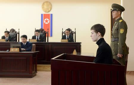 U.S. citizen Matthew Todd Miller (2nd R) sits in a witness box during his trial at the North Korean Supreme Court in Pyongyang September 14, 2014, in this photo released by Kyodo. REUTERS/Kyodo