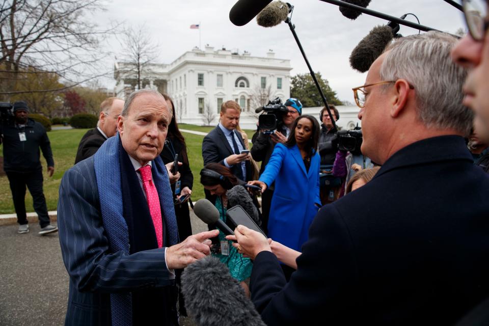 White House chief economic adviser Larry Kudlow talks to reporters outside the White House.