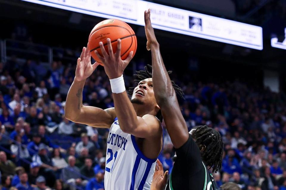 Kentucky guard D.J. Wagner (21) drives to the basket against Marshall during Friday’s game at Rupp Arena.