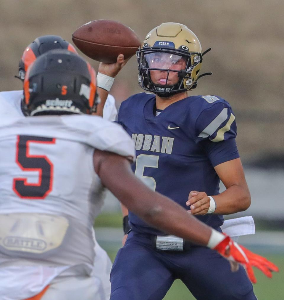 Hoban quarterback JacQai Long looks for an open receiver during the first quarter against Erie Cathedral Prep on Friday, Aug. 26, 2022 in Akron, Ohio, at Dowed Field.