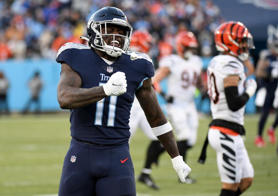 Tennessee Titans wide receiver A.J. Brown (11) celebrates after a catch during the first half of an AFC Divisional playoff football game against the Cincinnati Bengals at Nissan Stadium.