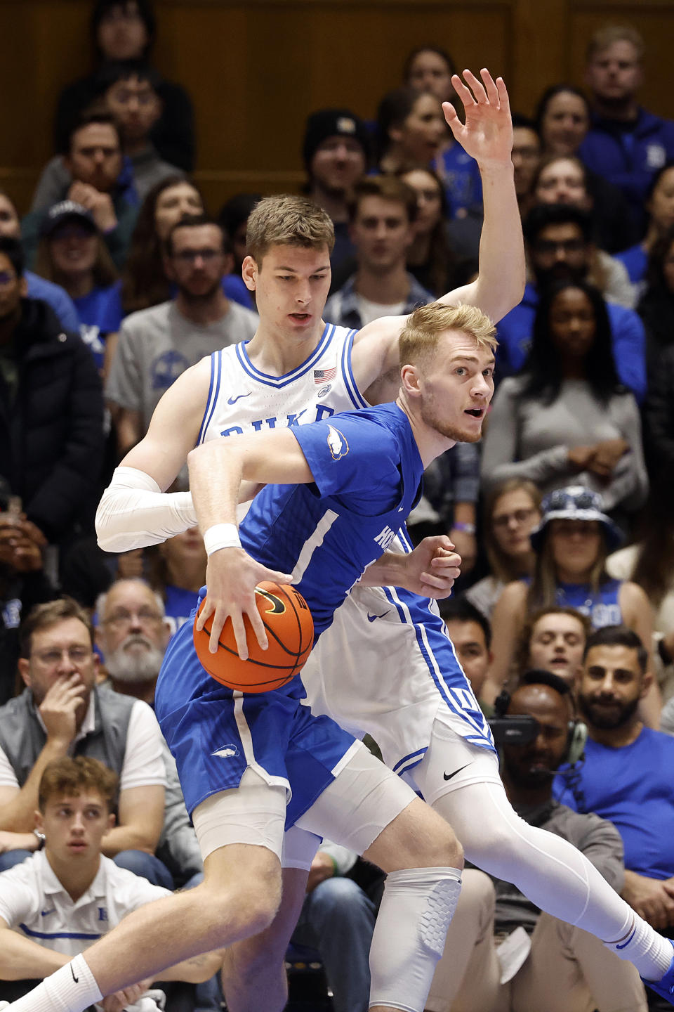 Hofstra's Jacco Fritz, front, looks for help when battling Duke's Kyle Filipowski, back, during the first half of an NCAA college basketball game in Durham, N.C., Tuesday, Dec. 12, 2023. (AP Photo/Karl B DeBlaker)