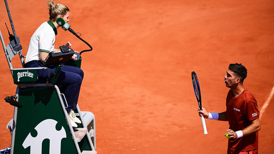 Thansi Kokkinakis argues with chair umpire Katarzyna Radwan-Cho at the French Open.