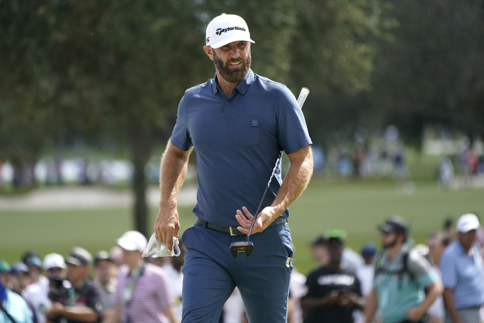 Dustin Johnson walks from the third green during the second round of the LIV Golf Team Championship at Trump National Doral Golf Club, Saturday, Oct. 29, 2022, in Doral, Fla. (AP Photo/Lynne Sladky)