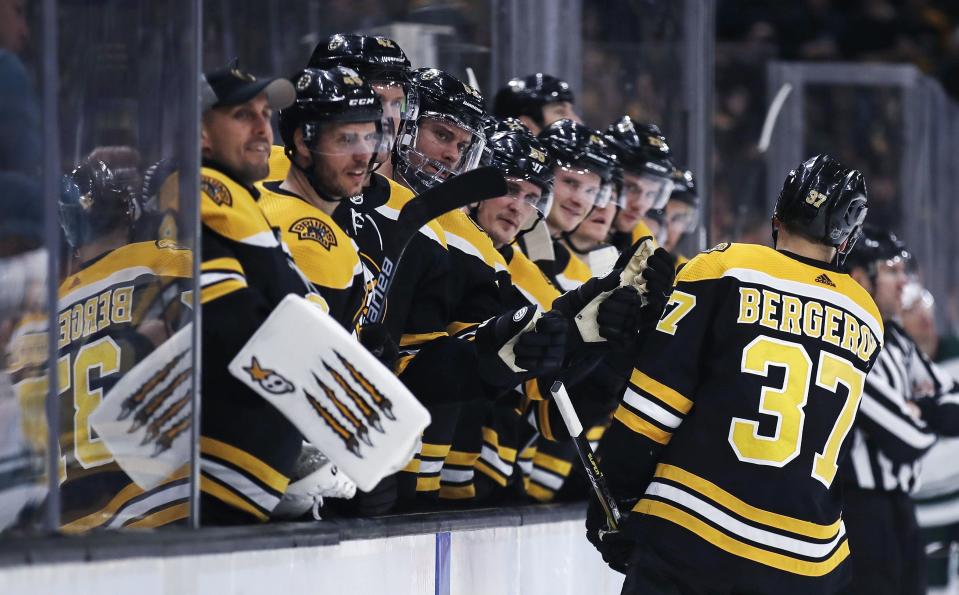 <p>
              Boston Bruins center Patrice Bergeron (37) is congratulated by teammates after his goal against the Minnesota Wild during the second period of an NHL hockey game in Boston, Tuesday, Jan. 8, 2019. (AP Photo/Charles Krupa)
            </p>