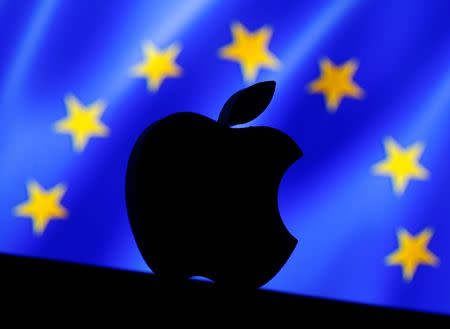 A 3D printed Apple logo is seen in front of a displayed European Union flag in this illustration taken September 2, 2016. REUTERS/Dado Ruvic/Illustration