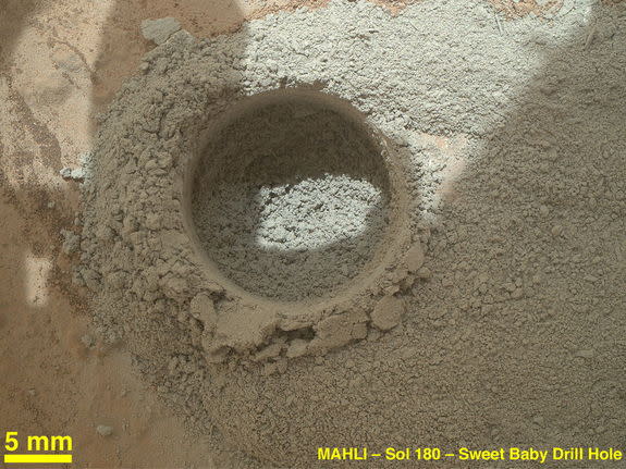 After an activity called the "mini drill test" by NASA's Mars rover Curiosity, the rover's Mars Hand Lens Imager (MAHLI) camera recorded this close-up view of the results during the 180th Martian day, or sol, of the rover's work on Mars (Feb. 6