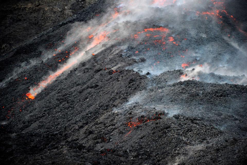 Lava from the Stromboli volcano flows into the sea,  on Aug. 10, 2014.