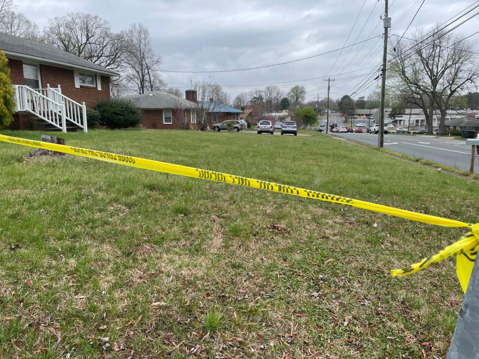 Police caution tape at the corner of Sellars Mill Road  and North Mebane Street after an officer-involved shooting on that block Wednesday, March 23.