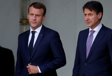 French President Emmanuel Macron accompanies Italian Prime Minister Giuseppe Conte after a meeting at the Elysee Palace in Paris, France, June 15, 2018. REUTERS/Philippe Wojazer