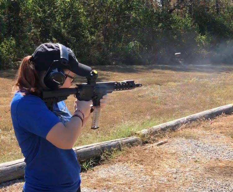 Courtney Griffieth fires a rifle at Burgin Gun Range in Burgin, Kentucky.