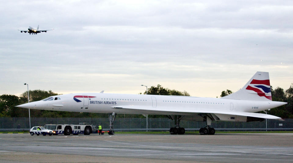 A British Airways Concorde makes its way from a maintenance hangar to Terminal Four at London's Heathrow Airport, before the supersonic aircraft was due to make its first commercial crossing of the Atlantic since the crash in France July 2000.  (PA)