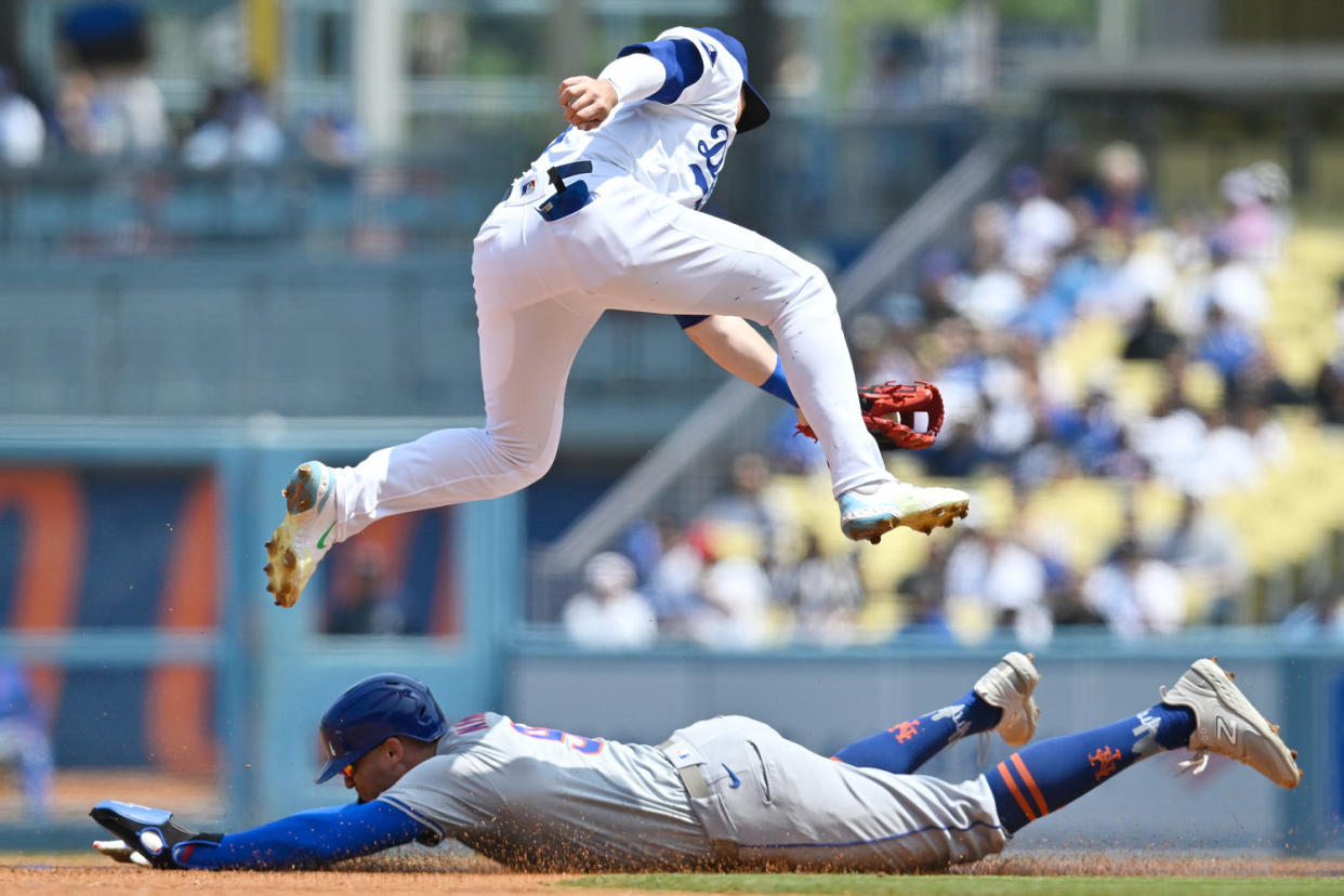  Brandon Nimmo #9 of the New York Mets steals second base in the first inning when Gavin Lux #9 of the Los Angeles Dodgers gets the throw late at Dodger Stadium on April 20, 2024 in Los Angeles,  (John McCoy / Getty Images)