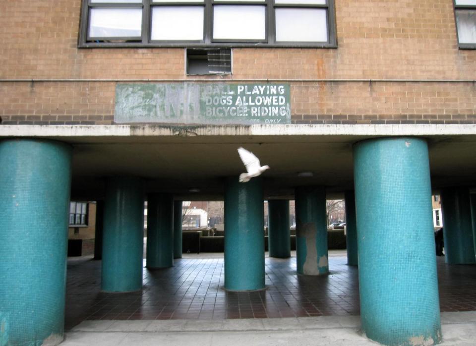 This April 7, 2013 image shows the former site of the Brooklyn Dodgers’ ballpark, Ebbets Field, which was torn down after the Dodgers moved to Los Angeles in 1957 and is today an apartment complex in the Crown Heights neighborhood. A faded sign in the courtyard says “No ball playing.” A new movie, “42,” tells the inspiring story of how Jackie Robinson integrated Major League Baseball when he played here for the Dodgers, beginning in 1947. (AP Photo/Beth J. Harpaz)