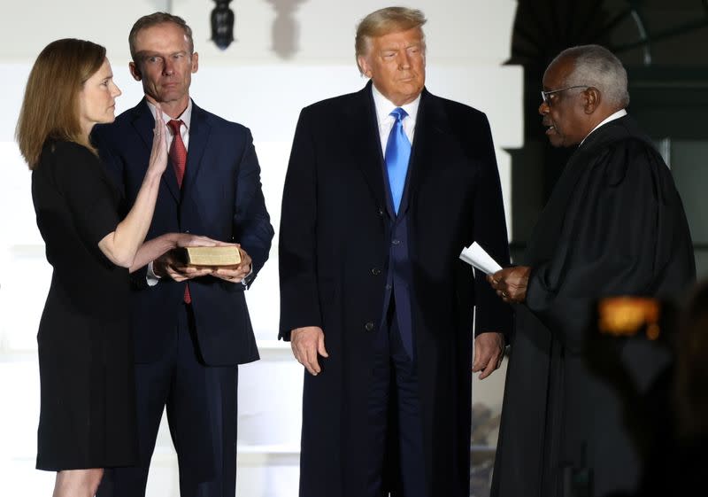 Judge Amy Coney is sworn in to serve as an associate justice of the U.S. Supreme Court at the White House in Washington